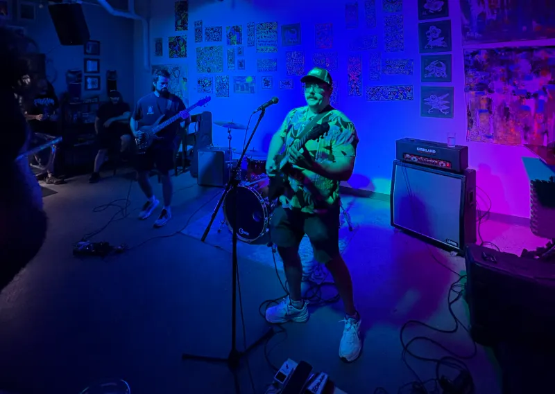 Sod The Earth live under blue stage light