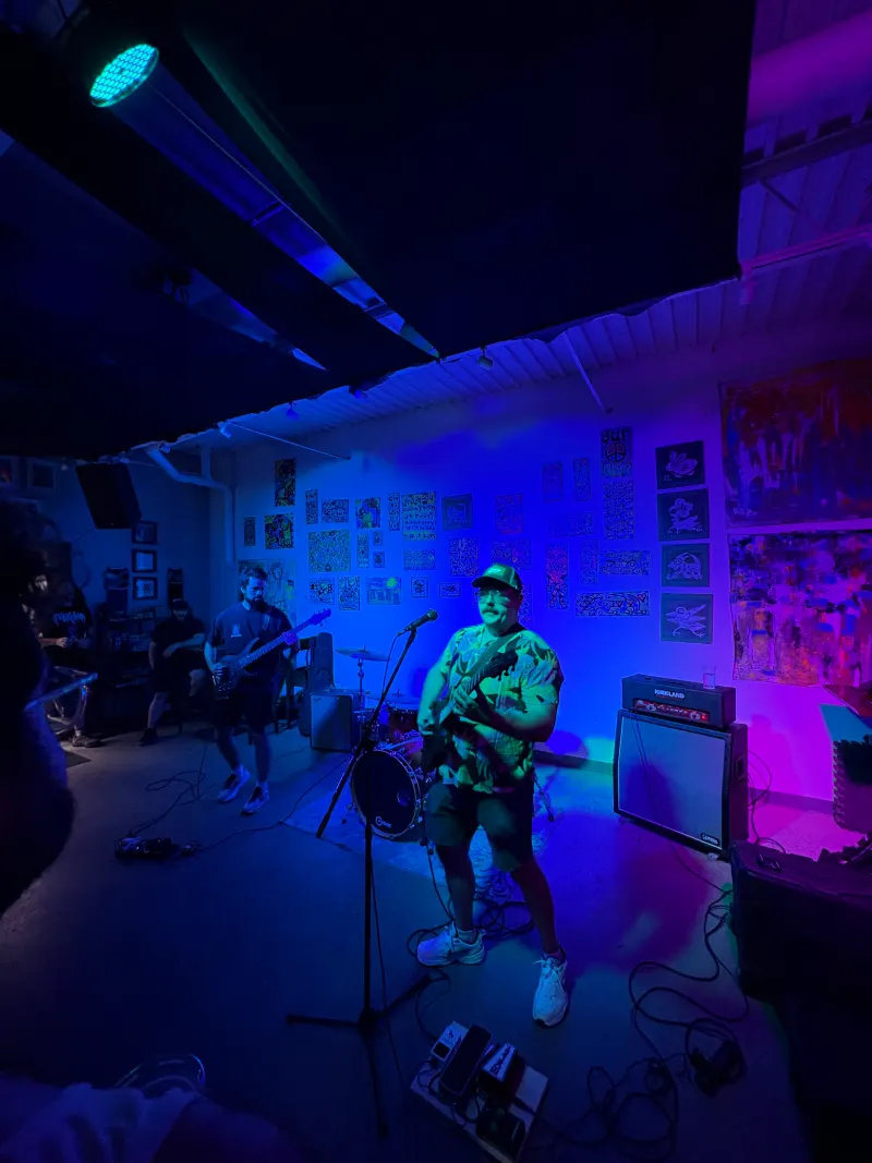 Sod The Earth live, blue light, vertical crop